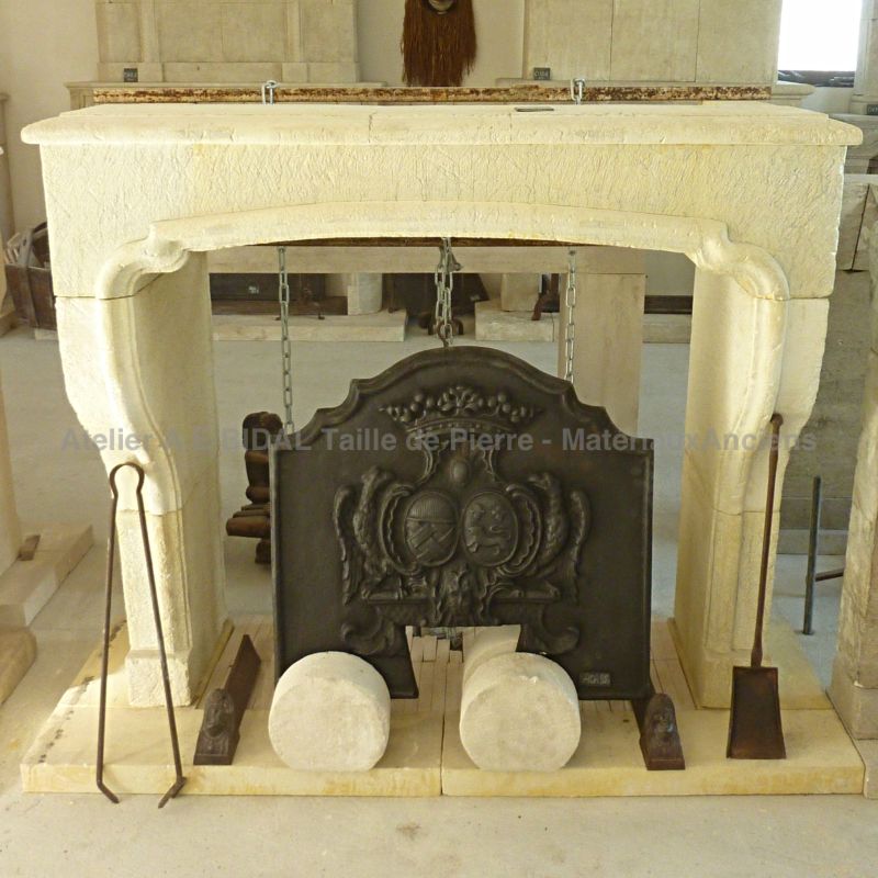 Louis XIII mantelpiece crafted by the stone cutters of the Atelier Alain Bidal in Provence.