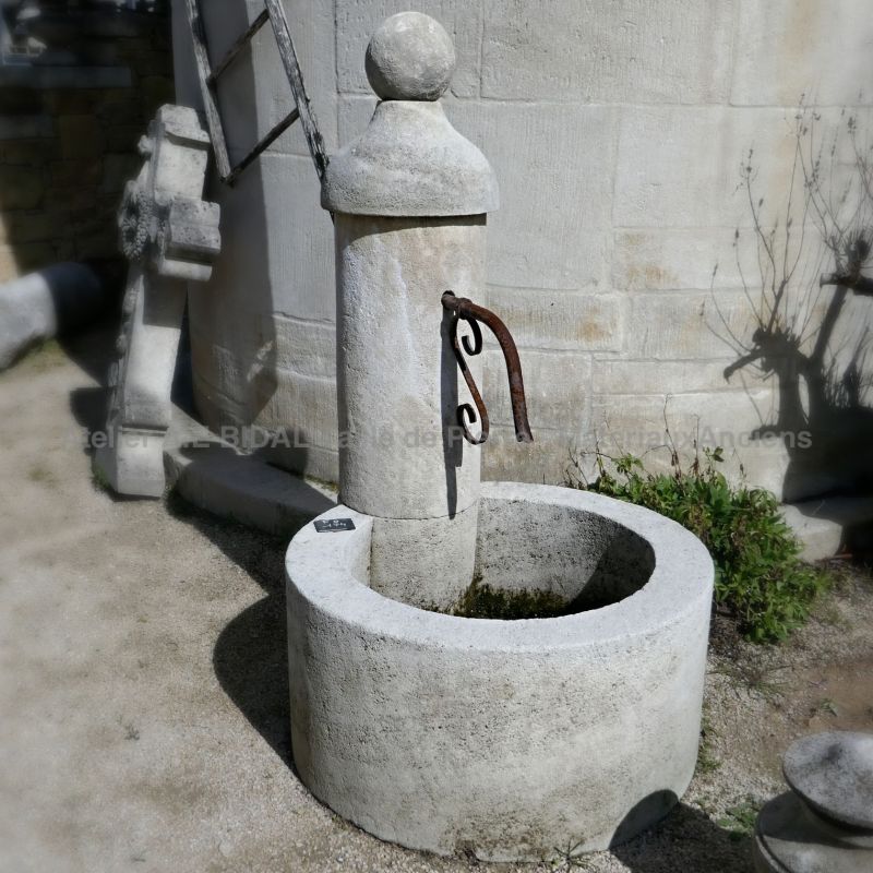 Small round garden fountain in natural stone | Stone water fountain for cheap garden decoration.