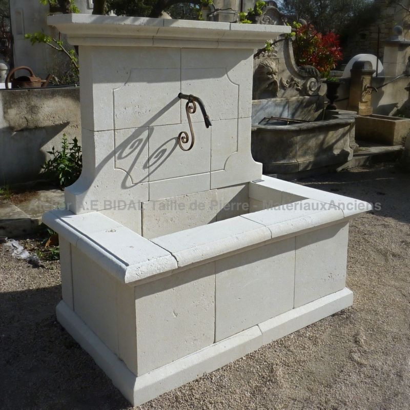 Ecological and sustainable stone fountain crafted by the stone cutter Alain Bidal in Provence.