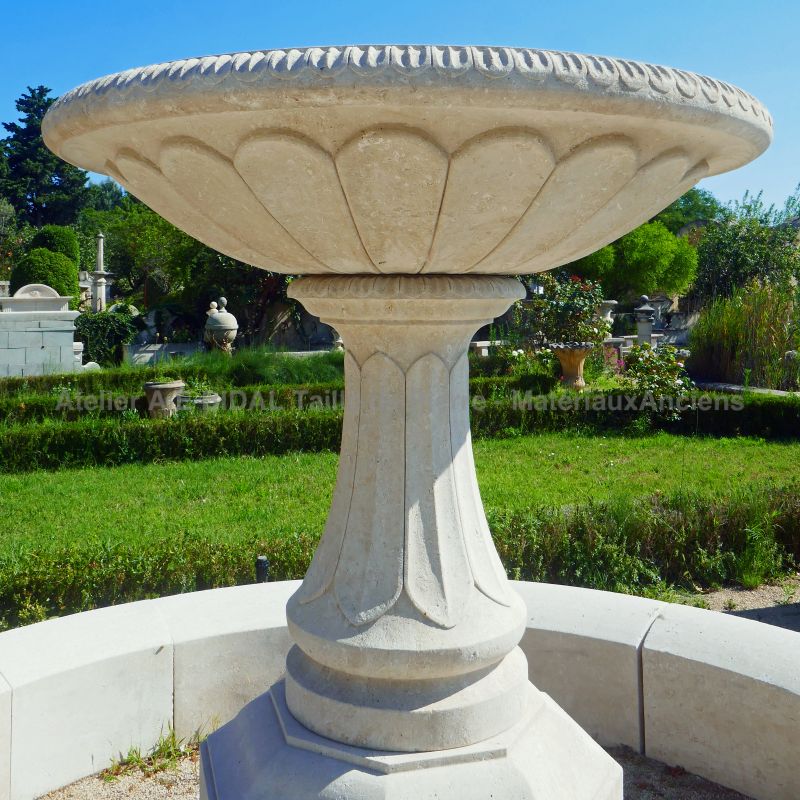 Central column and gadrooned bowl hand-carved in stone on our large central garden fountain - Atelier Alain BIDAL.