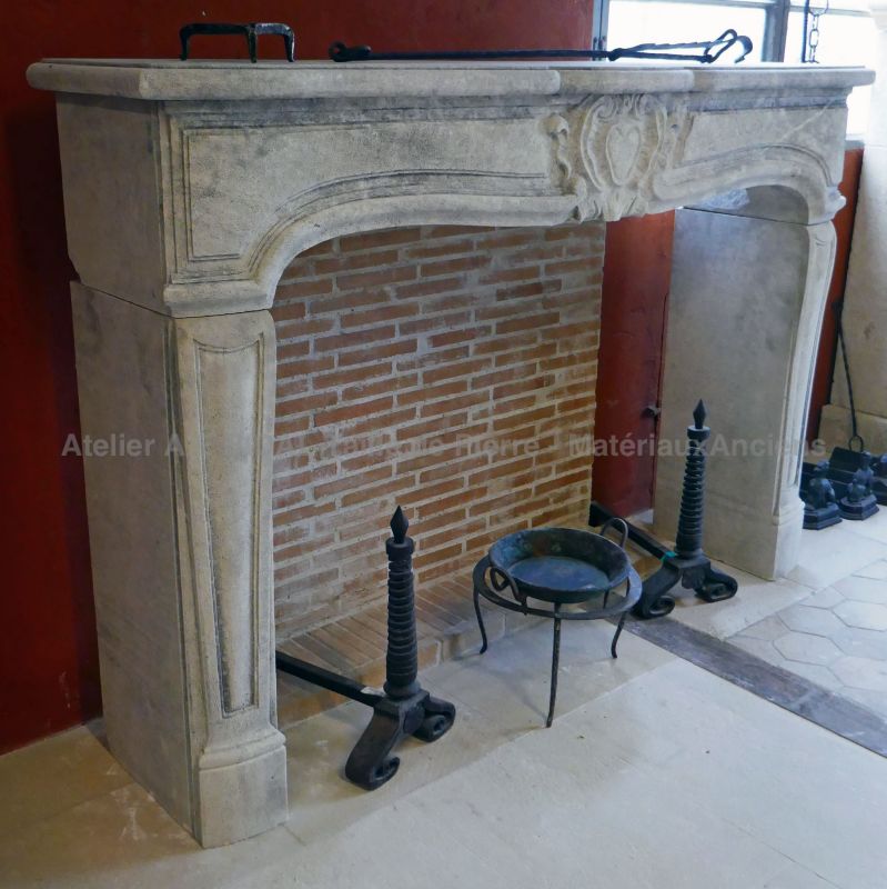 Classic French Regency mantelpiece in limestone by Atelier Alain Bidal, stonemason in Provence.