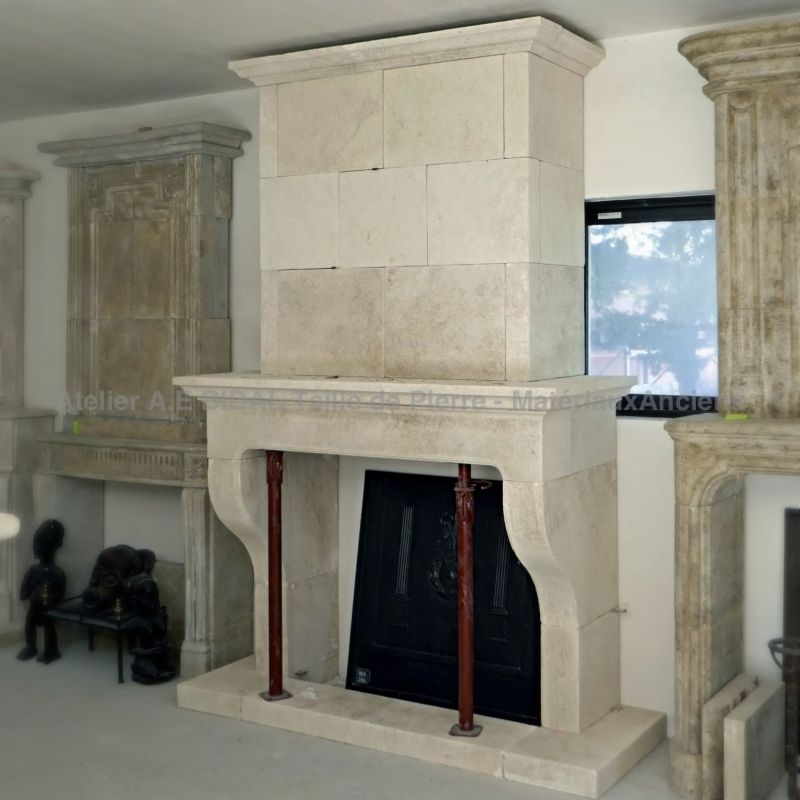 Provencal stone fireplace with trumeau by the manufacturer of stone fireplaces Atelier Alain BIDAL.