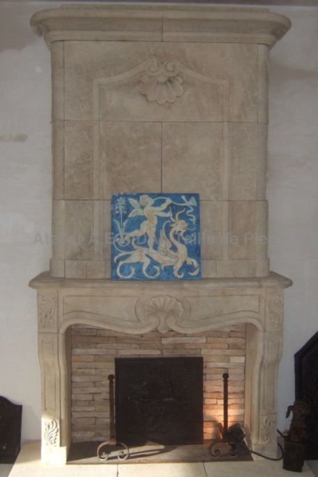 Stone fireplace with over-mantel, a beautiful Regency style mantel by Atelier Alain BIDAL (Provence)
