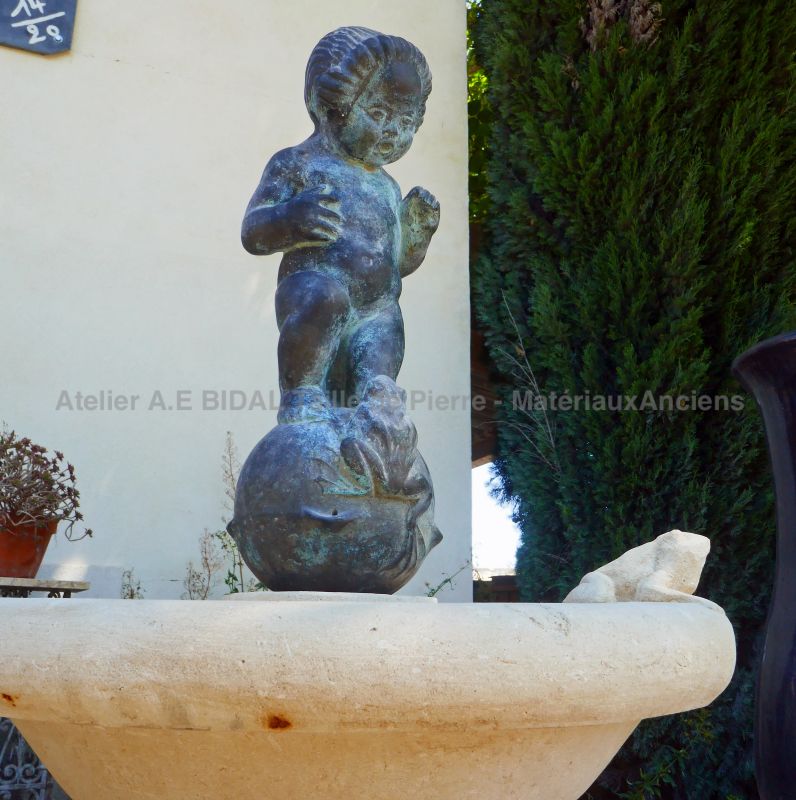 Putto and frog : central decor on our stone fountain for sale in Provence at Atelier Alain BIDAL