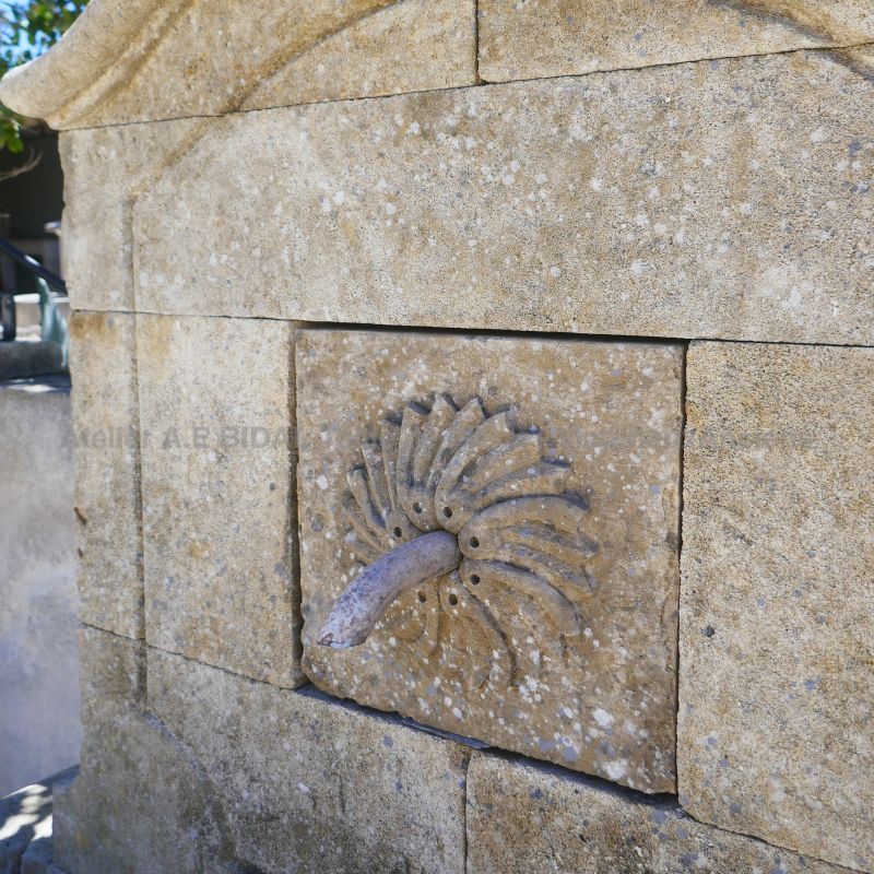 Picture of the water outlet on the pediment of our decorative garden fountain - Atelier BIDAL (Provence)