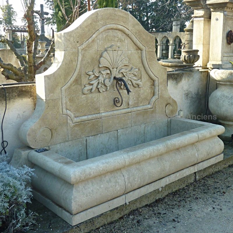 Fountain with a large bassin from the collection of fountains signed Alain Bidal, stonemason.