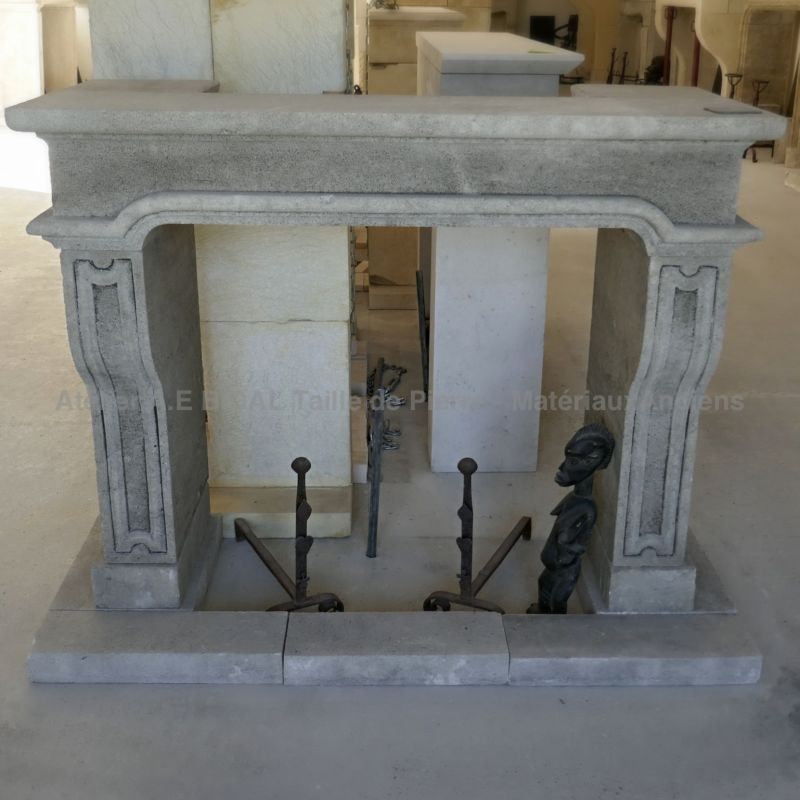 Louis XVI fireplace in stone, a classic mantelpiece crafted in Provence by Atelier Alain BIDAL