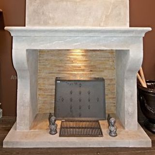 Elegant fireplace in stone in a rustic style. By the Bidal workshop in Vaucluse