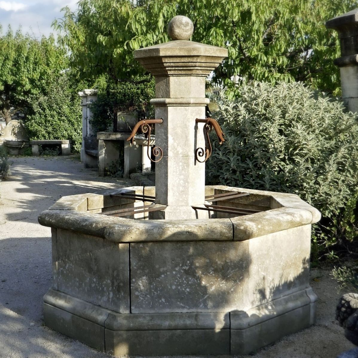 Central octagonal fountain in Avy stone aged and patined