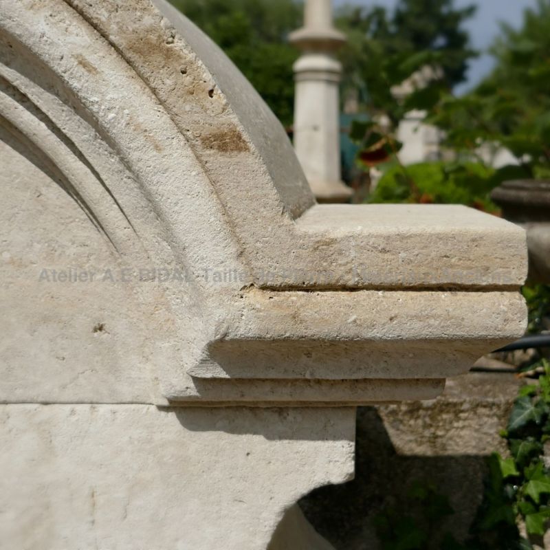 Detail of the hand carved moldings on the pediment of our stone wall fountain.