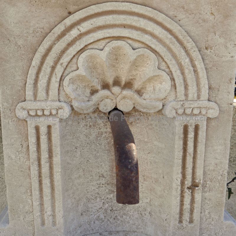 Carved limestone fountain by the stonemason in Provence of the Atelier Alain Bidal