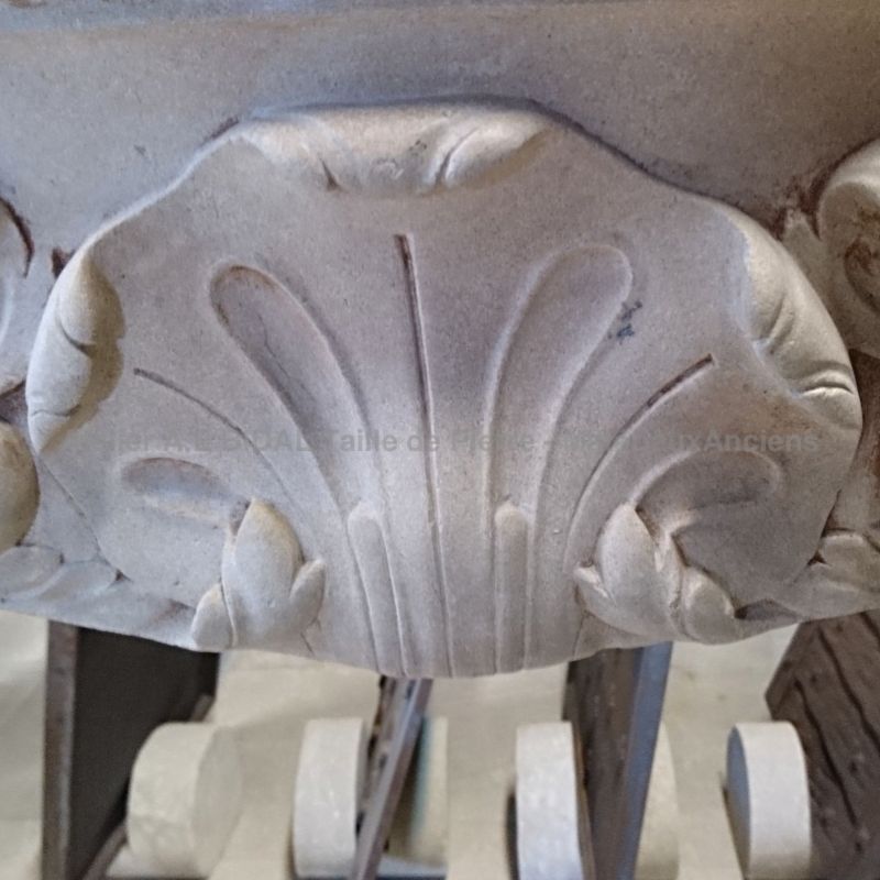 A fireplace in natural limestone from Burgundy artisanally manufactured in Provence.