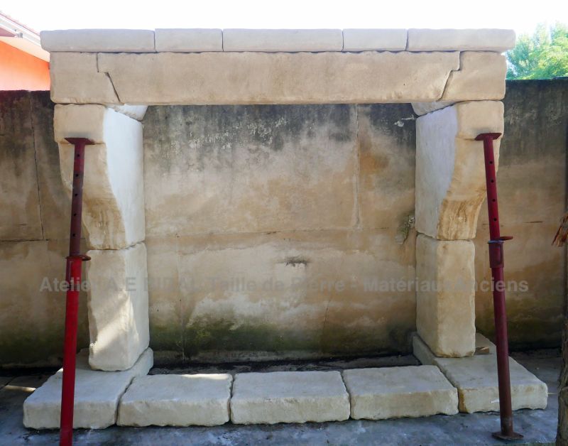 Designed and hand-crafted mantelpiece in stone - Large Provençal natural stone fireplace by Atelier Alain BIDAL (Provence)