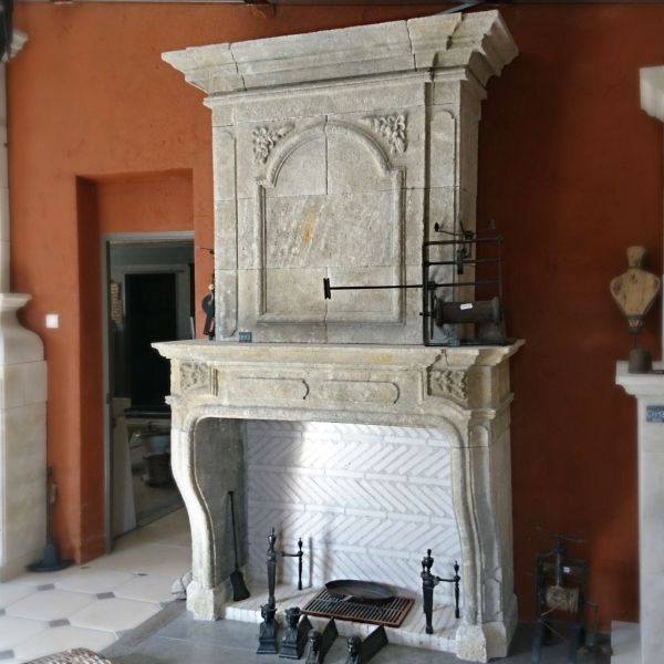 A Louis XV stone fireplace created by the craftman Bidal in Provence