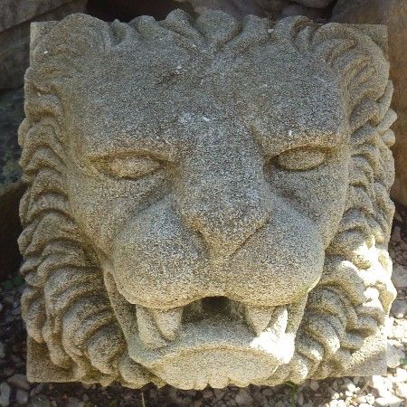 Sculpture of a lion's head  carved in natural stone by the Alain Bidal workshop, Provence