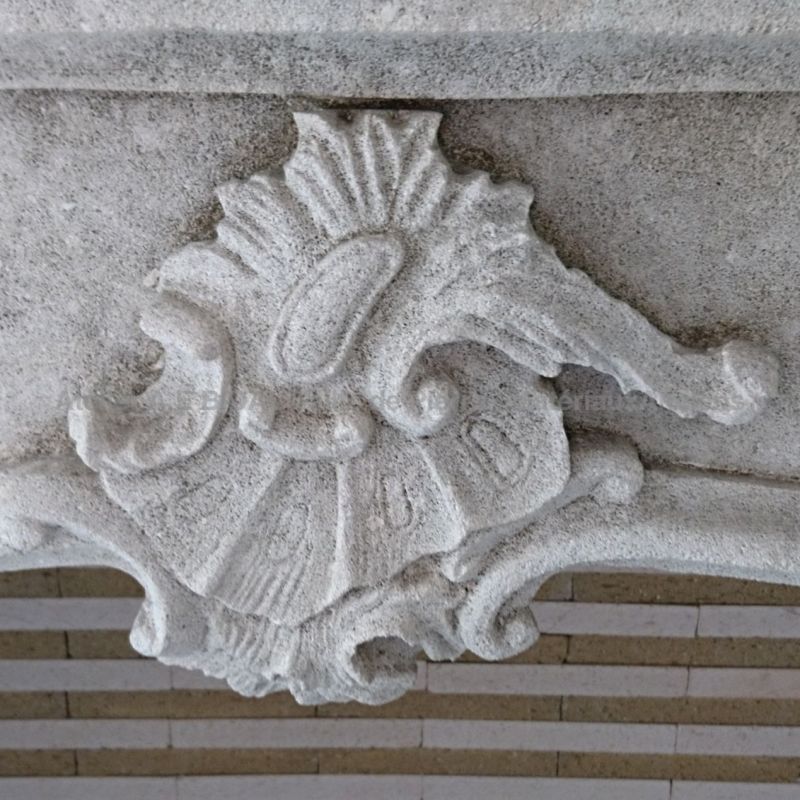 Classic French fireplace in stone - A tall fireplace with overmantle in natural stone by Atelier Alain BIDAL (Provence)