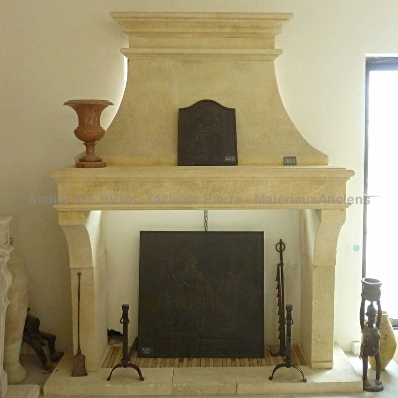 Stone fireplace of Louis-Philippe style crafted by the Alain Bidal workshop in Provence.