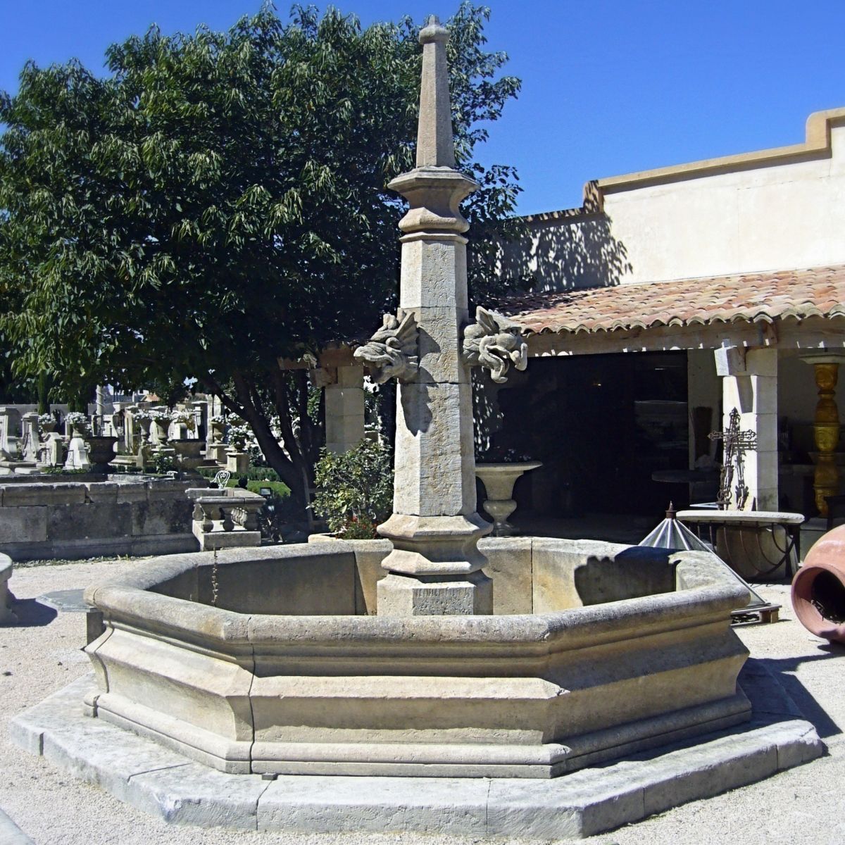 Hand-crafted Gothic fountain in stone by the stonemason Alain Bidal